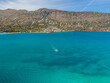 View of boat in Mirabello Bay with calm sea on Crete, Greece.