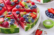watermelon pizza with yogurt and fresh berries,