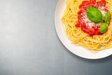 Fototapeta Paryż - iitalian spaghetti with basil and tomato