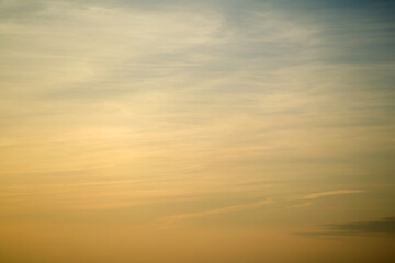 Wall Mural - Sunset sky was filled with a mix of yellow and orange clouds