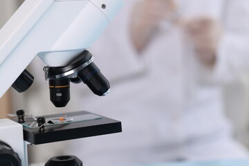 Wall Mural - quality control. food inspector working in laboratory, focus on microscope