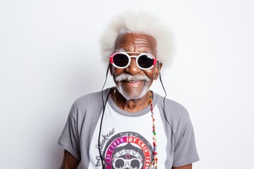 Portrait of a blissful afro-american elderly 100 years old man sporting a vintage band t-shirt over white background