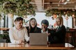 © Rawpixel.com - Business colleagues on laptop, laughing together