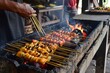 © GHArtwork - Chicken Satay on the traditional Asian grill