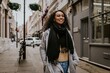 © Rawpixel.com - Cheerful woman walking in city