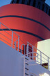 Red and black funnel of classic ocean liner cruise ship cruiseship Elizabeth Victoria against deep blue sky during Mediterranean cruise in summer	