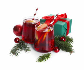 Wall Mural - Delicious Sangria drink in glasses and Christmas decorations on white background