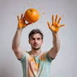 man holding orange