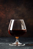 Fototapeta  - Cognac at dark background. Strong alcohol drink.