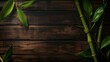 Dark, rich wooden background with green bamboo stems and leaves diagonally across the image.