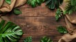 Tropical Leaves and Burlap on Wooden Background