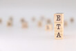 ETA acronym. Concept of estimated time of arrival written on wooden cubes isolated on white background.
