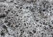 The texture of a frozen volcanic lava.Stone with a non-uniform surface.Magma rock background close up in Tenerife,Canary Islands,Spain.Selective focus.