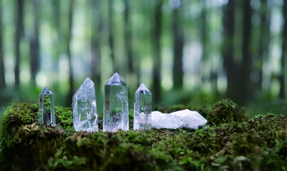 Sticker - set of Crystal minerals towers in forest, natural background. Clear quartz for Magic Crystal Ritual, Witchcraft. spiritual esoteric practice for relax, harmony,  life balance. healing stone therapy