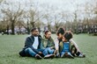 © Rawpixel.com - Happy African-American family sitting in a park