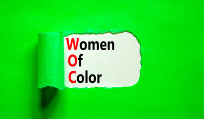 Wall Mural - WOC women of color symbol. Concept words WOC women of color on beautiful white paper. Beautiful green paper background. Business WOC women of color social issues concept. Copy space.