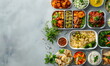 Lunch box with different food, on a simple light marble background. Healthy homemade food in takeaway boxes. Fast food, vegetables, herbs, meat, side dish, sauces