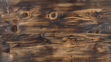 The Image Is Of A Wooden Surface With A Lot Of Burn Marks And Holes