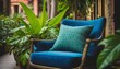 an image featuring a detailed close up of a blue chair adorned with a matching blue pillow and a vibrant green plant