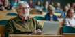 © MNStudio - Mature male student in a university lecture hall listening to a professor explaining modern technology trends. Education for elderly people.