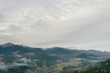 Wall Mural - Aerial view of beautiful mountain village on cloudy day