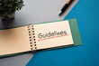 © hogehoge511 - There is notebook with the word Guidelines. It is as an eye-catching image.