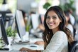 © FANI ICONS - Young Woman Working on Computer in Modern Office