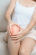 woman having knee ache and muscle pain due to Runners Knee or Patellofemoral Pain Syndrome, osteoarthritis, arthritis, rheumatism and Patellar Tendinitis. medical concept