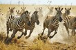 A large herd of zebras galloping across the savanna