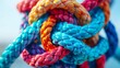 This image captures the beauty and complexity of knotted ropes in vibrant colors, creating a dynamic and artistic display of marine rope technology.
