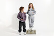 © New Africa - Fashion concept. Stylish children with vintage suitcase on white background