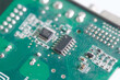 Close up of microchips on  green pcb board. 