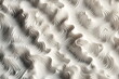 a close up of a white background with a pattern of wavy lines
