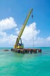 A crane involved in an underwater construction project, like building a bridge pier or marine research station