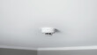 Smoke detector sensor on ceiling. Indicator of fire. House security system.