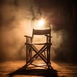 movie directors chair. nobody is sitting in the chair. the spotlight is on the chair