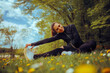 Woman Stretching her Legs Working Outdoors in a Meadow. Carefree girl exercising in nature feeling great and healthy

