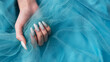Female hands with blue nail design. Blue nail polish manicure.