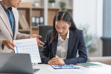 Asian businesswoman and businessman facing workplace challenges. From age diversity to handling mistakes and consequences like bankruptcy, emphasizing accountability, and learning from errors.