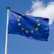 european union flag at a pole, fluttering in the wind