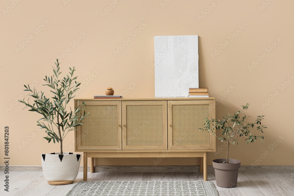 Interior of living room with painting on commode