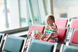 Kids travel and fly. Child at airplane in airport