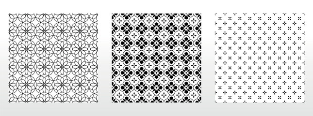 Wall Mural - Geometric floral set of seamless patterns. White and black vector backgrounds. Damask graphic ornaments.