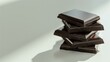 A minimalist style close-up of a stack of dark chocolate