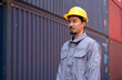 Portrait Asia logistic engineer man worker or foreman working at container site	