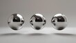 Three Floating Chrome Spheres in Minimalist Grey Background