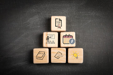 Wall Mural - Concept of educational development. Wooden blocks on a blackboard background