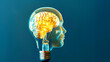 Creative mind concept with head shaped light bulb glowing brain