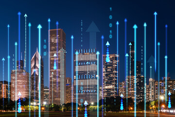 Wall Mural - Nighttime cityscape with digital hologram of rising arrows and binary code, technology and business concept with skyscrapers on urban background. Double exposure