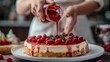 Woman pouring jam on a cheesecake